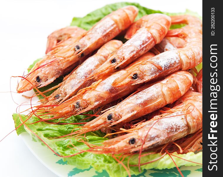 Fried shrimps with lettuce, food photography