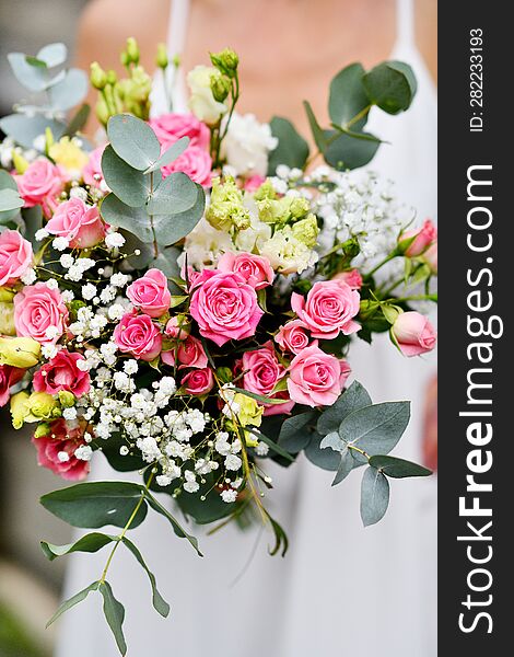 Bride With A Bouquet Of Roses In Her Hands