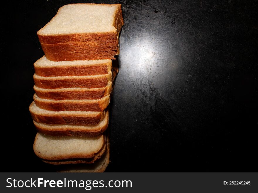 Bread Pieces on Black Background