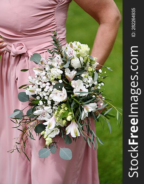 Young Girl With A Bouquet Of White Flowers