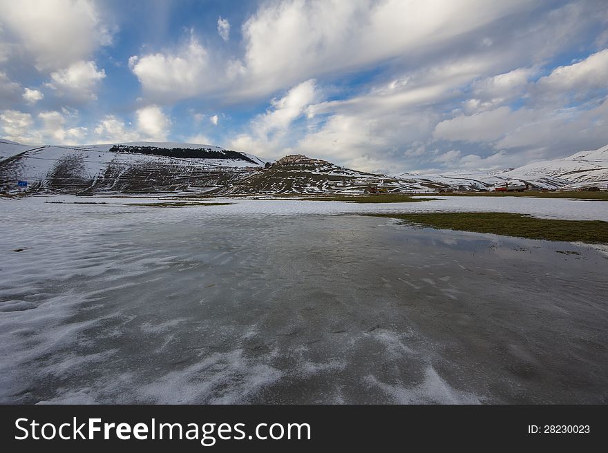 Winter landscape with ice and blue sky