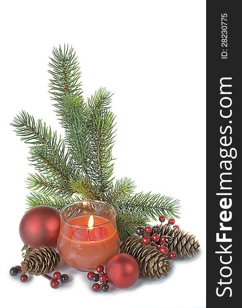 Vertical christmas composition with a burning candle