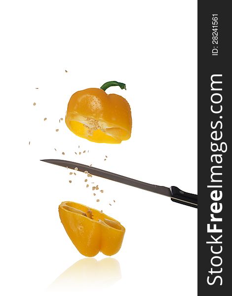 Yellow Paprika is knifed at with seeds