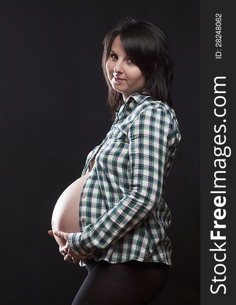 Beautiful pregnant woman playing with balloons