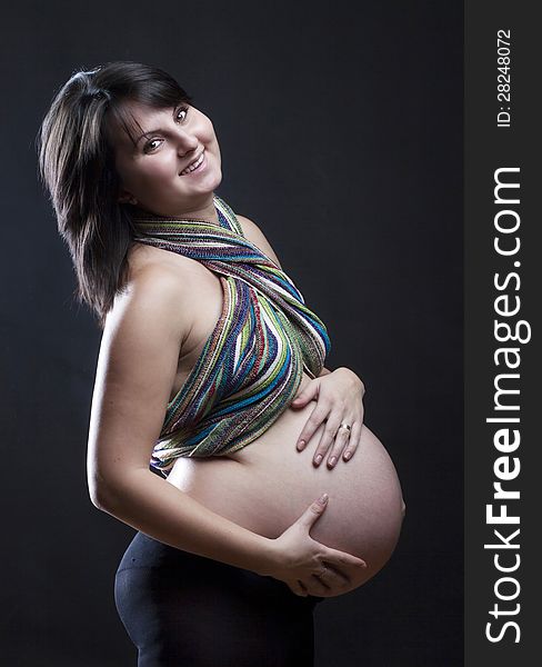 Beautiful pregnant woman playing with balloons