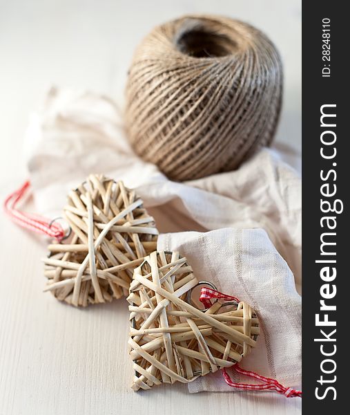 Hearts made of straw on a wooden background