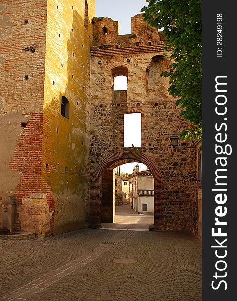 The medieval village of Castellaro Lagusello, Province of Mantova, Italy. The main gate. The medieval village of Castellaro Lagusello, Province of Mantova, Italy. The main gate