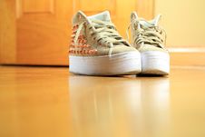 Pair Of Funky Used Sneakers Shoes On Hard Wood Floor Royalty Free Stock Photos Pair Of Funky Used Sneakers Shoes On Hard Wood Floor Royalty Free Stock Photos