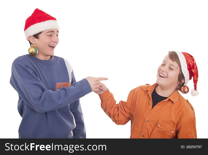 Happy young friends laughing and wearing Christmas hat’s