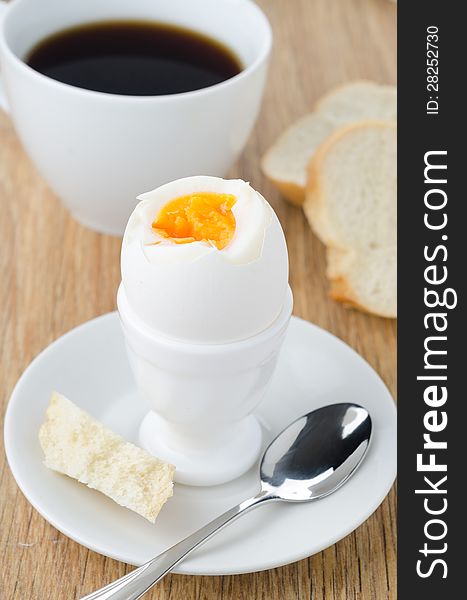 Boiled eggs, bread and coffee for breakfast