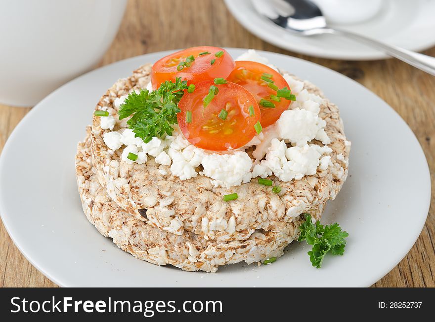 Bread with cottage cheese, cherry tomatoes for breakfast closeup