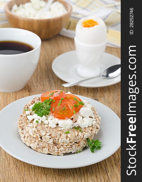 Bread with cottage cheese, cherry tomatoes, boiled egg and coffee