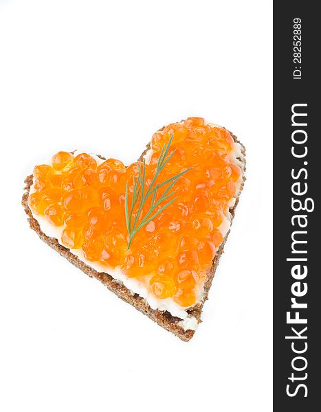 Sandwich with red caviar in the form of a heart  isolated on a white background