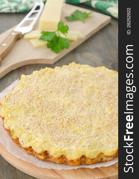 Tart with cabbage and cheese on a wooden cutting board. Tart with cabbage and cheese on a wooden cutting board