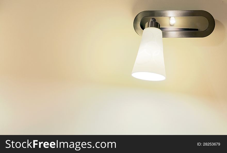 Details of modern small lamp on a wall, good as light and decor. Details of modern small lamp on a wall, good as light and decor.