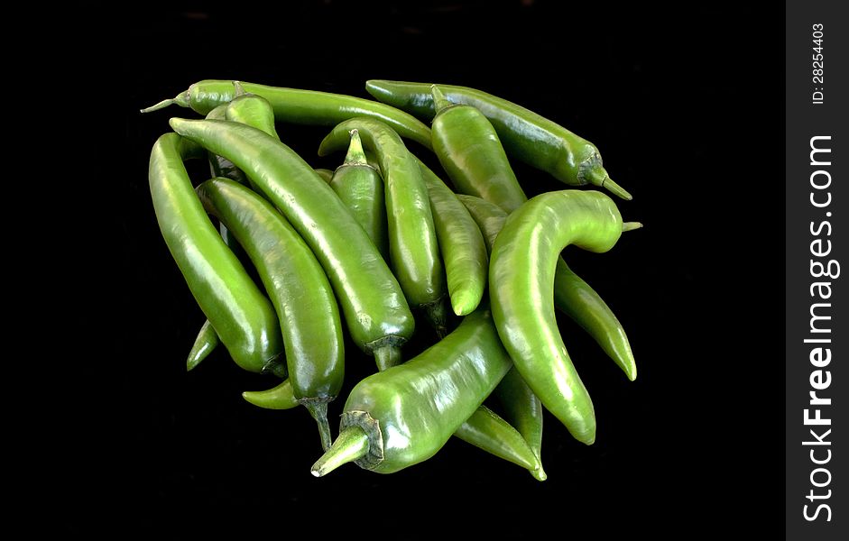 Green hot  pepper chili over black background. Green hot  pepper chili over black background