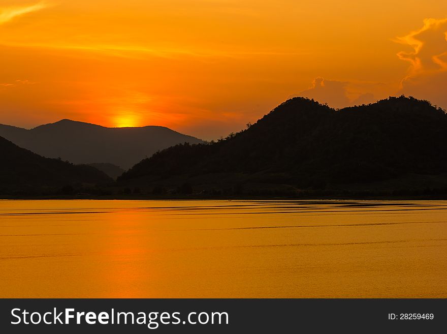 Colorful sunset over the water at dam. Colorful sunset over the water at dam