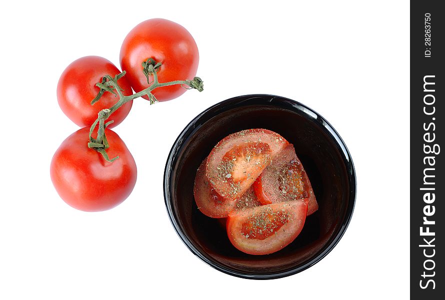 Salad with tomatoes and three tomatoes on a white background