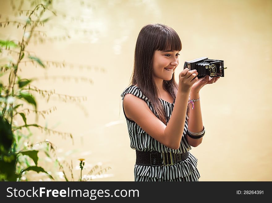 Girl with antique camera