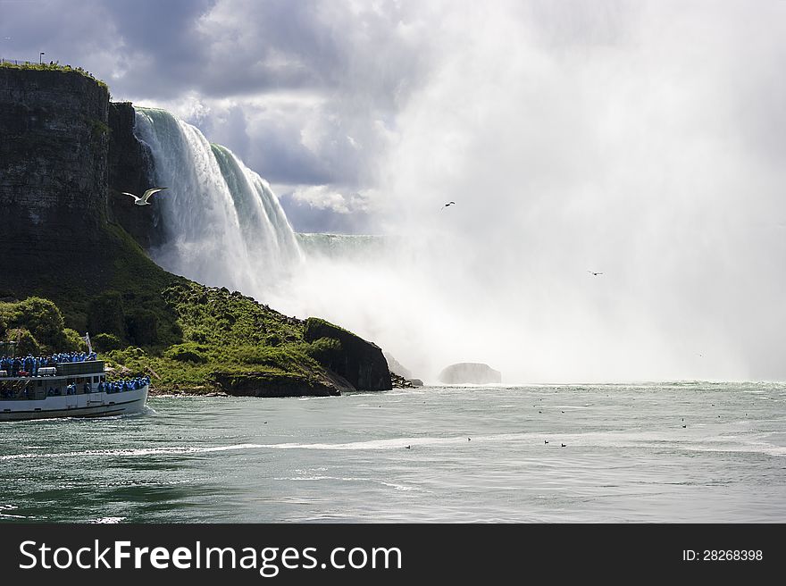 Tourists visiting bottom of Niagara Falls. Tourists visiting bottom of Niagara Falls