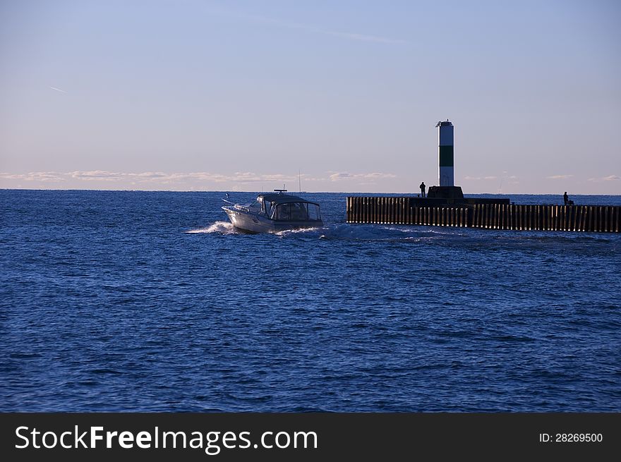 Boat Passing lighthouse