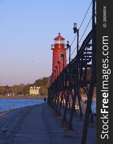 Lighthouse on lakeshore with elevated power supply. Lighthouse on lakeshore with elevated power supply