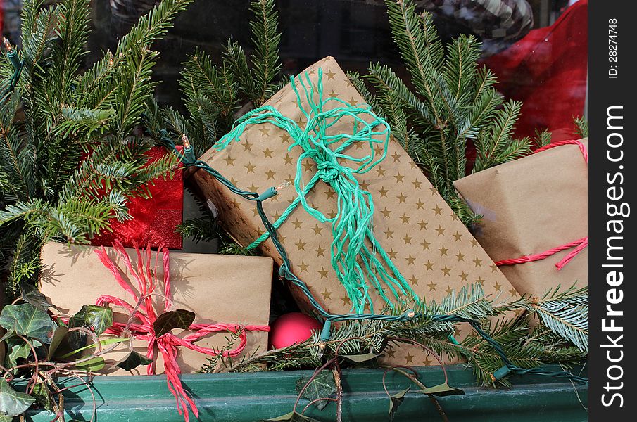 Simple wrapping of Christmas presents  in brown paper with colorful twine bows. Simple wrapping of Christmas presents  in brown paper with colorful twine bows.