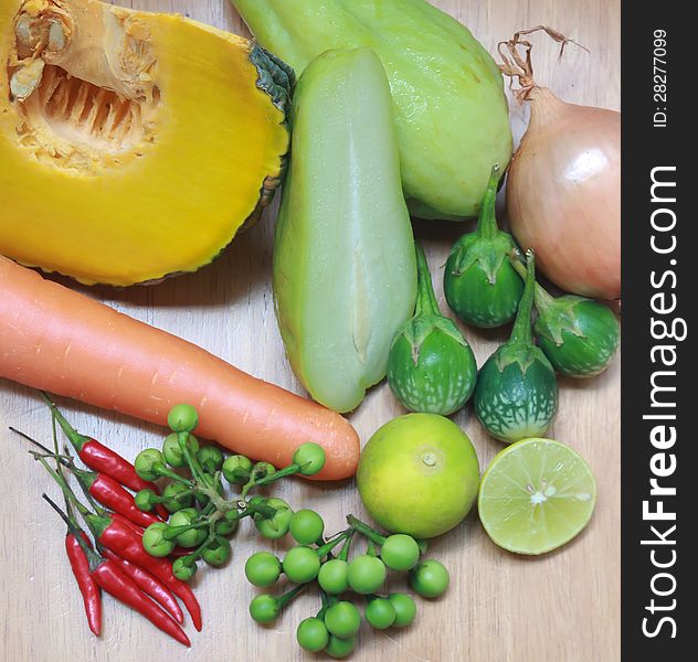 Still life with variety of vegetables on wood background