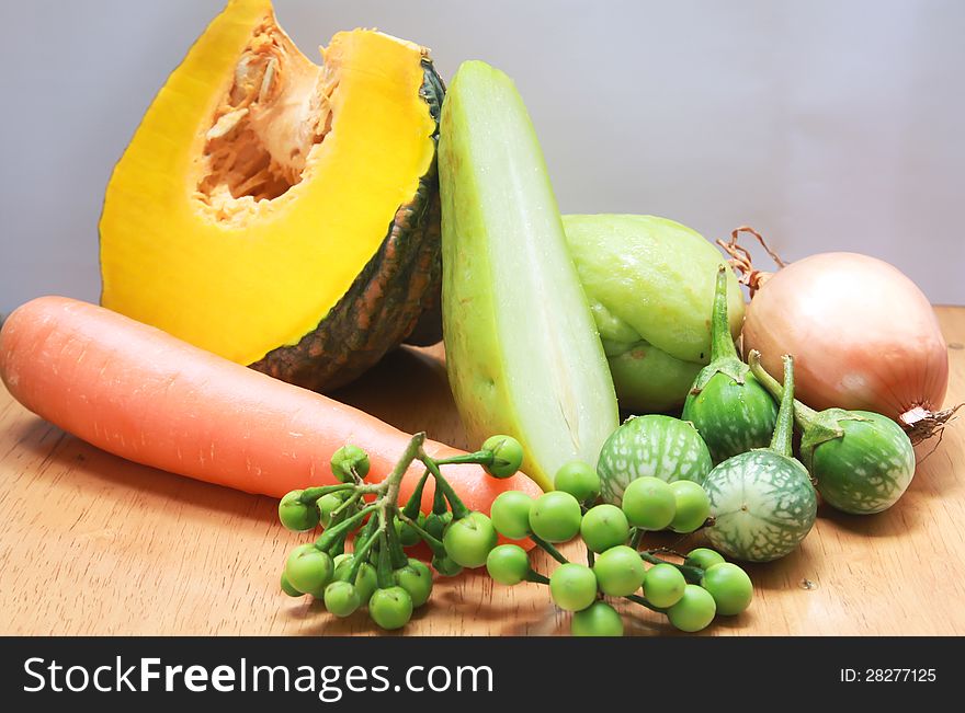 Still life with variety of vegetables on wood background