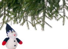Snowman And Spruce Branches. Royalty Free Stock Photography