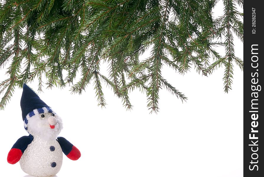 Snowman and spruce branches. background.