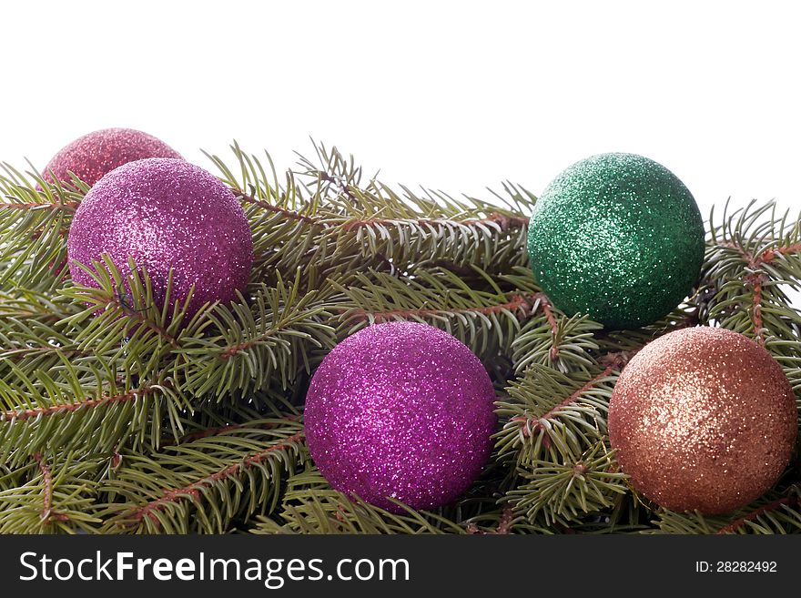 Colored balls are on the fir trees.background