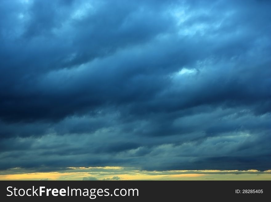 The dark Storm clouds over horizon. The dark Storm clouds over horizon.