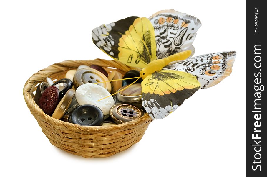 The photo shows the buttons for sewing in basket and decorative butterfly. The photo shows the buttons for sewing in basket and decorative butterfly