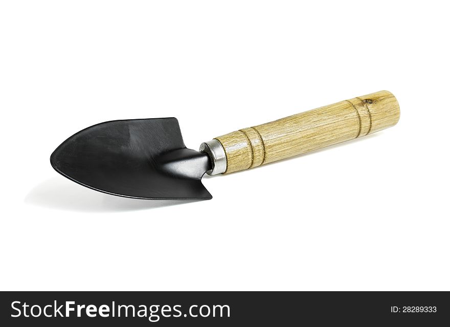 Steel shovel with a wooden handle on white background with clipping path