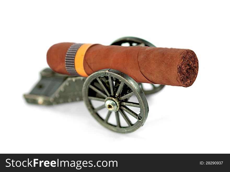 Artillery gun carriage and a cigar on a white background. abstraction