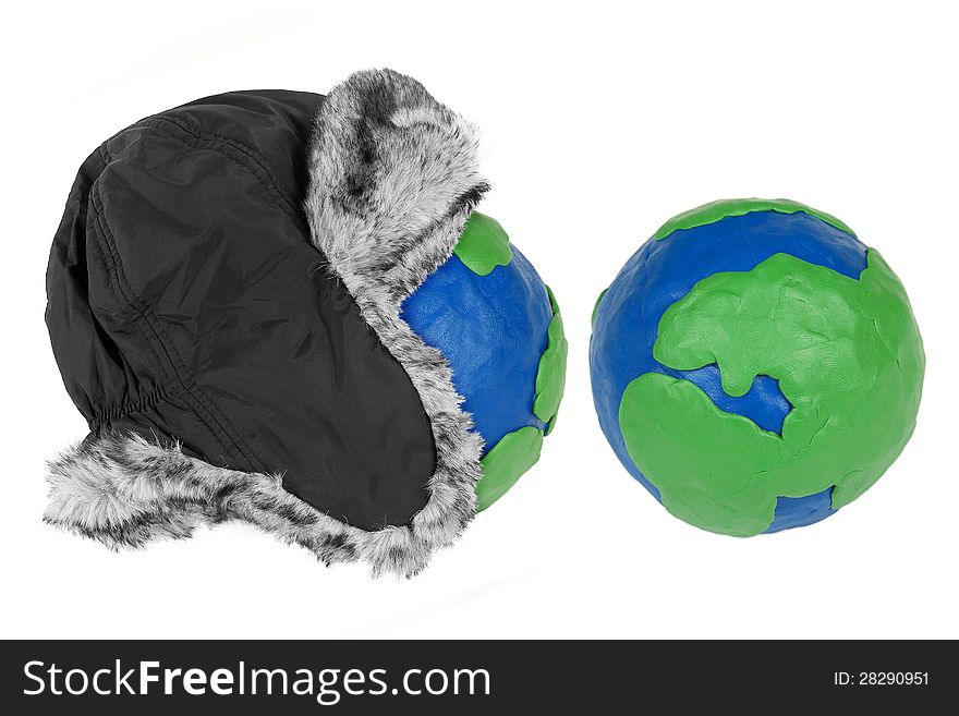 Winter hat and two plasticine Hemisphere