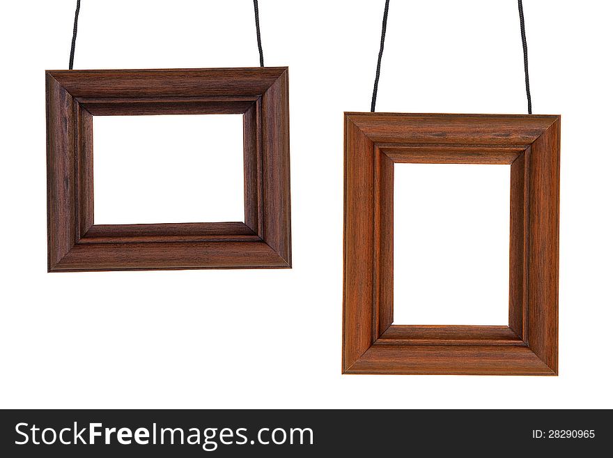 Two wooden photographic frame hanging on black cord. Two wooden photographic frame hanging on black cord