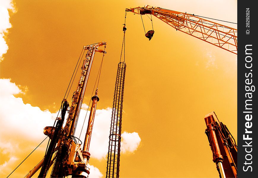 Long beam cranes on building construction site. Long beam cranes on building construction site