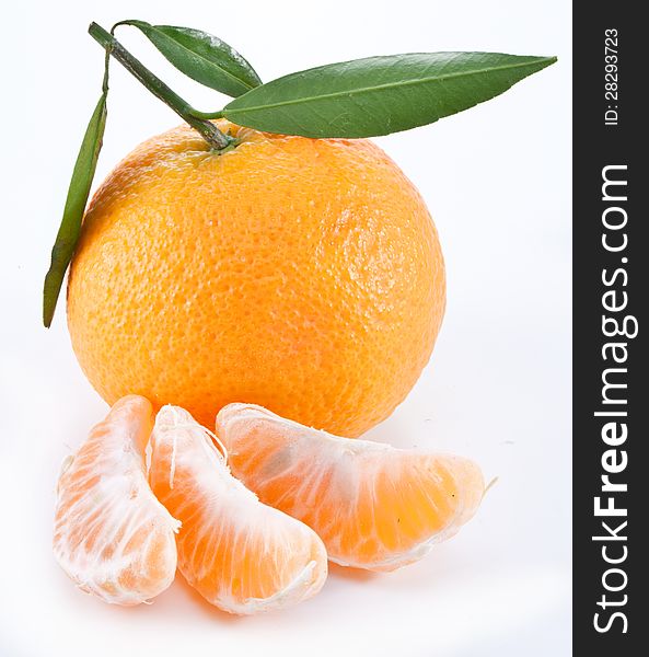 Tangerines with leaves on a white background. Tangerines with leaves on a white background.