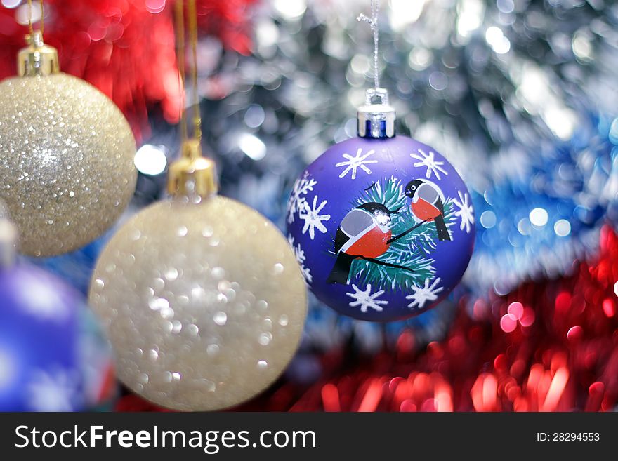 Christmas toy against the background of new year's tinsel. Christmas toy against the background of new year's tinsel