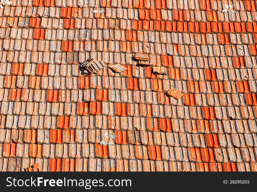 Old red tile on a roof