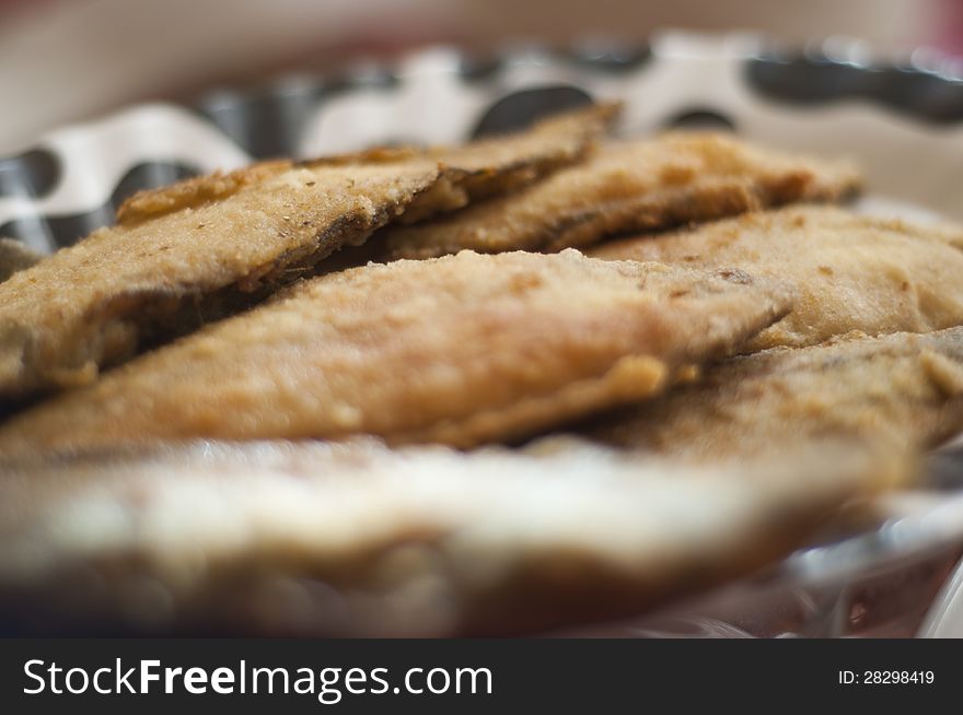 Breaded and  Frying plaice fish on a plate. Breaded and  Frying plaice fish on a plate