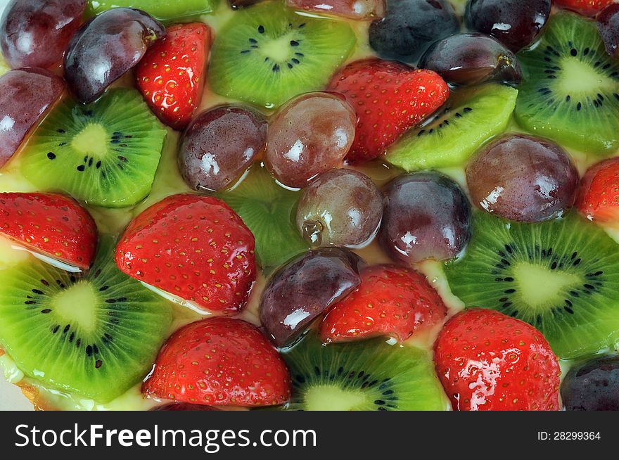 Fruit cake dessert close up, kiwis and strawberries. Fruit cake dessert close up, kiwis and strawberries