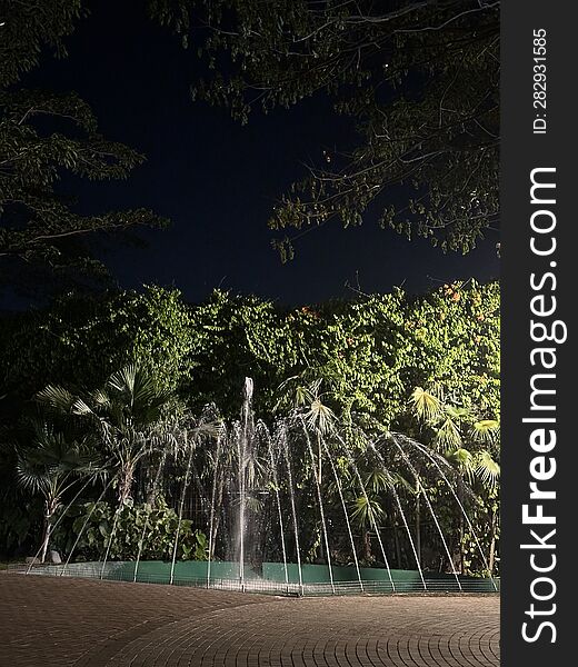 A fountain can be seen spraying its water in the middle of the night, in a garden within a residential area in Bintaro, Indonesia. A fountain can be seen spraying its water in the middle of the night, in a garden within a residential area in Bintaro, Indonesia.