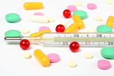 Thermometer And Pills Royalty Free Stock Images Thermometer And Pills Royalty Free Stock Images