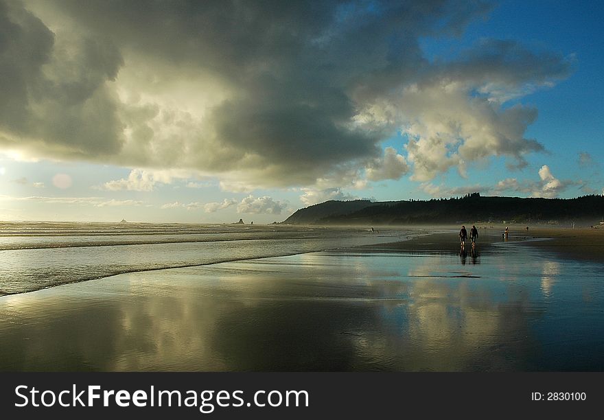 Colorful reflections off the beach with dramatic clouds. Colorful reflections off the beach with dramatic clouds