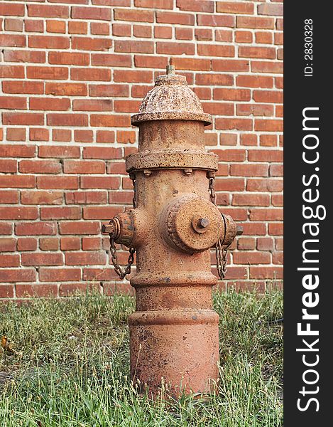 Old fire hydrant and beick wall. Old fire hydrant and beick wall