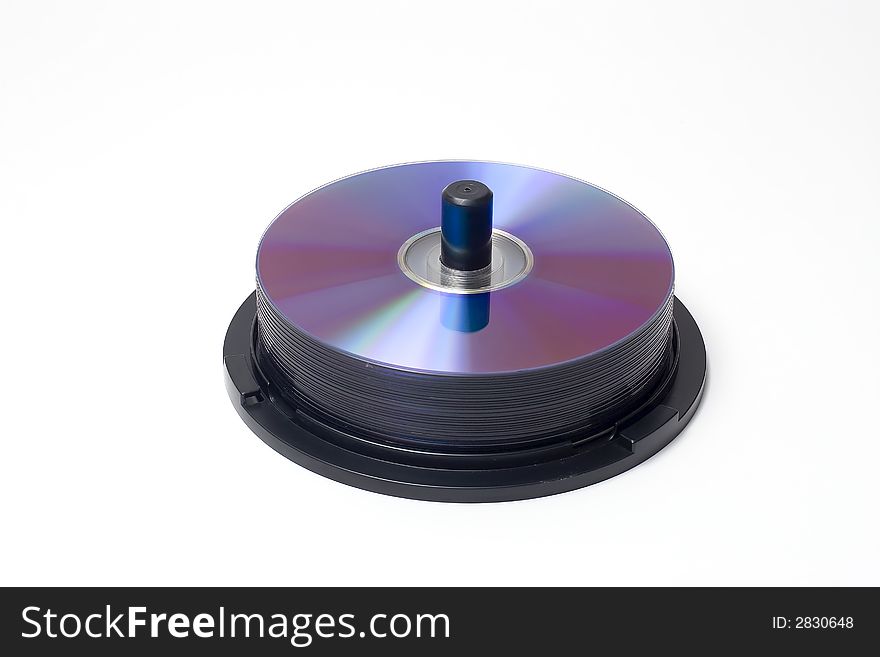 A spindle containing a piles of cd's/dvd's. A spindle containing a piles of cd's/dvd's