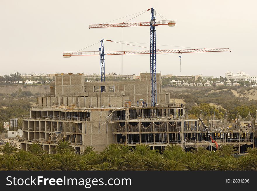 Workers is building a hotel. Workers is building a hotel.